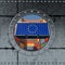 Looking through a ship Porthole. Container with European Union flag being loaded.