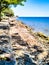 looking from the shoreline, a ship could be seen far away in the vast expanse