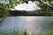 Looking through trees into relaxing lake and mountain view