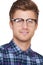 Looking trendy. Closeup portrait of a handsome young hipster wearing glasses.