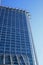 Looking up at blue glass reflective office