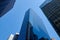 Looking up at buildings in the Lower Manhattan Financial District. In the center is 33 Whitehall Street, the Broad Financial