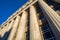 Looking up at Civil Courts building with stone Greek flutted columns and ornate design