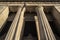 Looking up at Civil Courts building with stone Greek flutted columns and ornate design