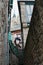 Looking up through dark alleyway onto Mont Saint-Michel abbey tower beautiful lantern old style vintage