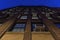 Looking up at a facade of a tall brick building on Manhattan`s Upper East Side at night, New York City