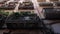 Looking up - house exterior of balconies lined with green potted plants in Barcelona Gothic Quarter. Facades of medieval