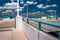 Looking up a parking garage ramp, under a blue summer sky in Tow