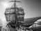 Looking up at sailors working, on traditional sailing vessel