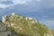 Looking up at Town of La Turbie with Trophee des Alpes and church, France