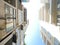 Looking up view multistory apartment building with caged-balcony, small back alley in downtown Hanoi, Vietnam, row of condo blocks