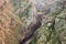 Looking way down at the Arkansas River and train running beside it in the Royal Gorge in Colorado