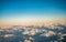 Looking through the window aircraft during flight a snow covered Italian and Osterreich Alps with blue sky without clouds