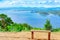 Lookout point with resting wooden bench. Beautiful scenery of nature with a large reservoir above the Srinagarind Dam at Rai Ya