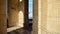 A lookout terrace on the 30th floor of Culture Palace in Warsaw. People looking through barred windows on the terrace  located on