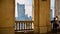 A lookout terrace on the 30th floor of Culture Palace in Warsaw. People looking through barred windows on the terrace  located on