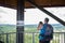 Lookout tower man take picture smartphone summer closeup view tourism travel
