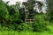 Lookout wooden ladder seat, also known as hunter`s seat, hunter`s high seat between the trees in nature for observing wild animals