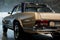 It looks as though it`s just from the store. Photo of brown vintage polished and shiny car parked indoors