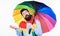 It looks like rain. Hipster checking if rain drops. Bearded man holding colorful umbrella. Colorful person holding open