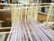 Loom and threads. Antique equipment for the production of carpets, clothing and woven household items. Threads and yarns