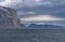 Looming Cliffs in a Glacial Fjord