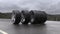 Loop car tires rolling on wet asphalt in the rain with a thunderstorm