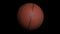 Loopable rotating basket ball with alpha channel. Basketball ball on black background