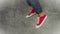 Loopable Stop Motion Animation of Young Person in Jeans and Red Sneakers Running