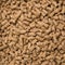 Looped Close-Up Rotation of Compacted Wooden Sawdust Pellets - Natural Cat Litter Filler or Organic Fuel.