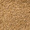 Looped Rotation of Compacted Wooden Sawdust Pellets with Brown Stones. - Natural Cat Litter Filler or Organic Fuel