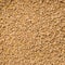 Looped Rotation of Compacted Wooden Sawdust Pellets with Small Brown Stones. - Natural Cat Litter Filler or Organic Fuel