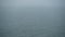 Looped video, heavy fog over water surface