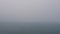 Looped video, thick fog over water surface