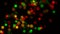 Looping 3D animation of the shining red, green, yellow light defocused particles circular bokeh