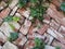 Loosely stacked garden brick wall background photograph.