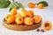 Loquat Medlar fruit with leaves on wood background