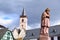 Lorch, Germany - 03 14 2022: medieval bishop statue and the church of Lorch am Rhein