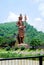 Lord Shiva tall statue with snake near Har ki Pauri Haridwar, Hindu god idol Mahadev at a garden with blue sky background and