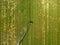 Loriol sur Drome, France - August 2022: Aerial view by a drone of a field being irrigated by powerful irrigation system.