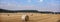 lorraine landscape in the north of france with straw bales under blue summer sky