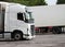 Lorries parked up outside a company`s car parking area