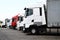 Lorries parked up outside a company`s car parking area