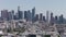 Los Angeles aerial skyline cityscape sightseeing view. Office towers crowded downtown LA aerials panoramic view. Pan and tilt. 4K