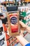 Los Angeles, CA/USA 08/09/2019 Shoppers hand holding a Plastic Jar of Nestle Nescafe Tasters Choice brand instant coffee