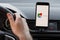 LOS ANGELES, CALIFORNIA - JUNE 6, 2019: Close up to male driving and using navigation appliction Google Maps. Get direction. An