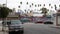 LOS ANGELES, CALIFORNIA, USA - 27 OCT 2019: Urban skyline and palms. LA city aesthetic, graffiti painting on Vermont street.