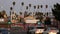 LOS ANGELES, CALIFORNIA, USA - 30 OCT 2019: Urban skyline and palms. LA city night aesthetic, graffiti painting on Vermont street