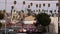 LOS ANGELES, CALIFORNIA, USA - 30 OCT 2019: Urban skyline and palms. LA city night aesthetic, graffiti painting on Vermont street