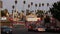 LOS ANGELES, CALIFORNIA, USA - 30 OCT 2019: Urban skyline and palms. LA city night aesthetic, graffiti painting on Vermont street